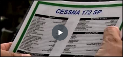 Someone holding a flyer with a heading of Cessna 172 SP